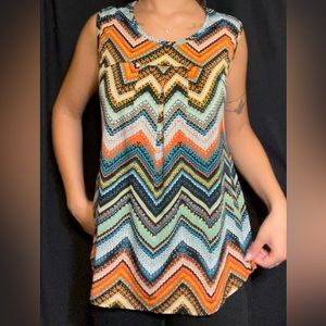 Women’s elegant dressy patterned waterfall fit tank top.